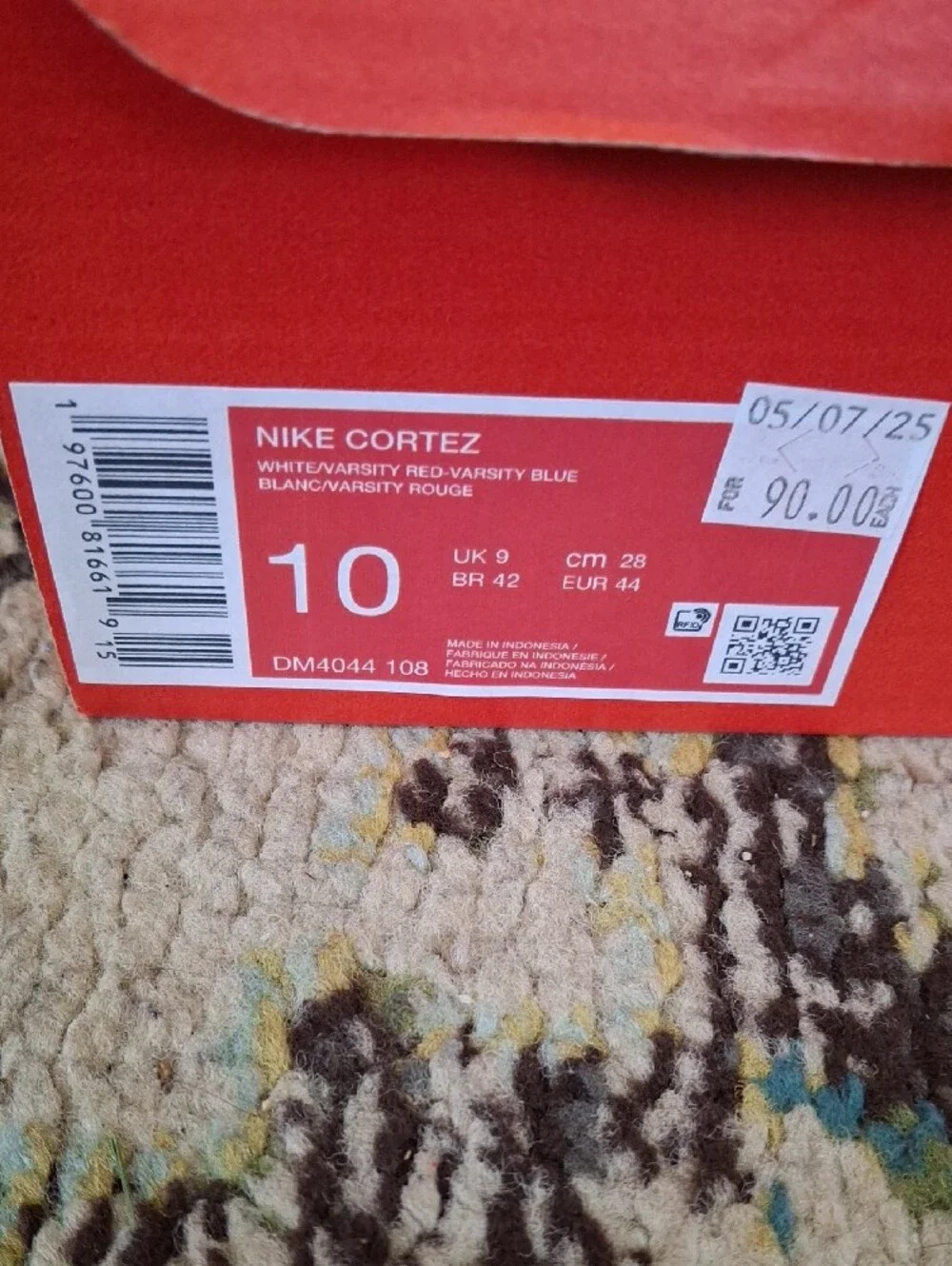 Nike White Sneakers with Red Swoosh and Blue Stripe